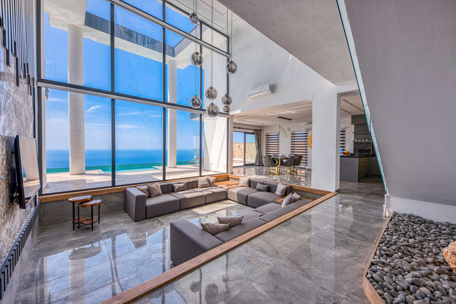 Modern living room with ocean view through floor-to-ceiling windows