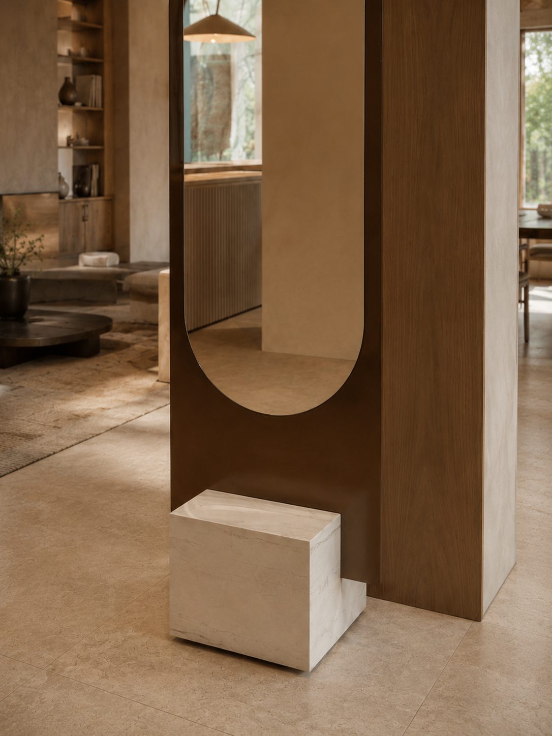 Alice mirror against a wood partition in a coastal home