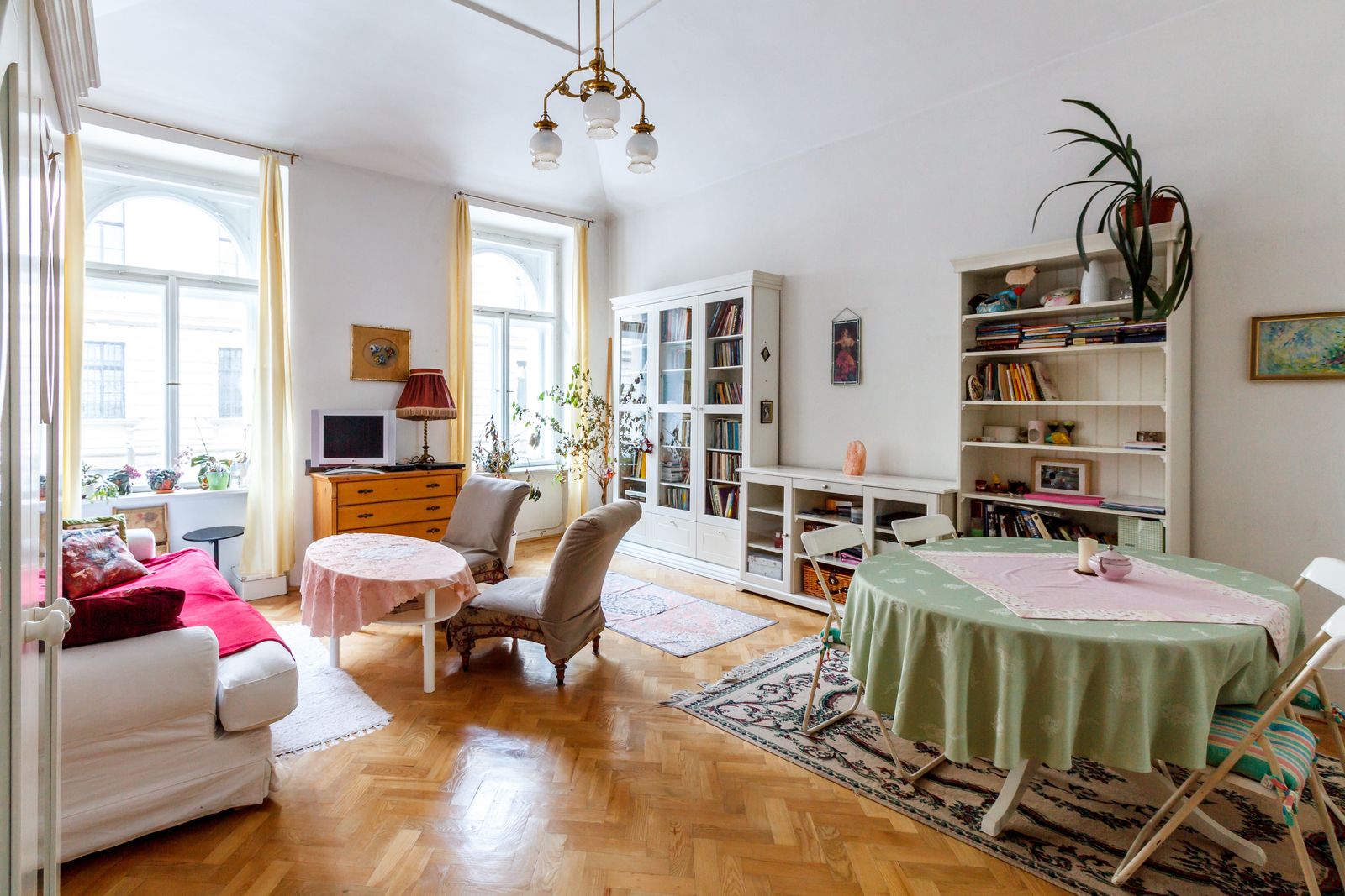 Bright living room with a white sofa, armchairs and light walls