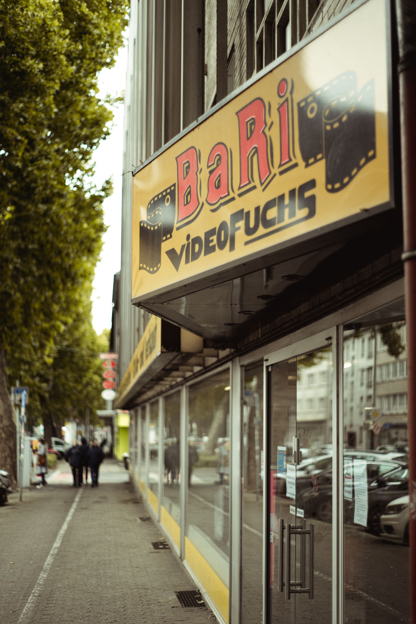 Shop front with a large glass window facing a sidewalk