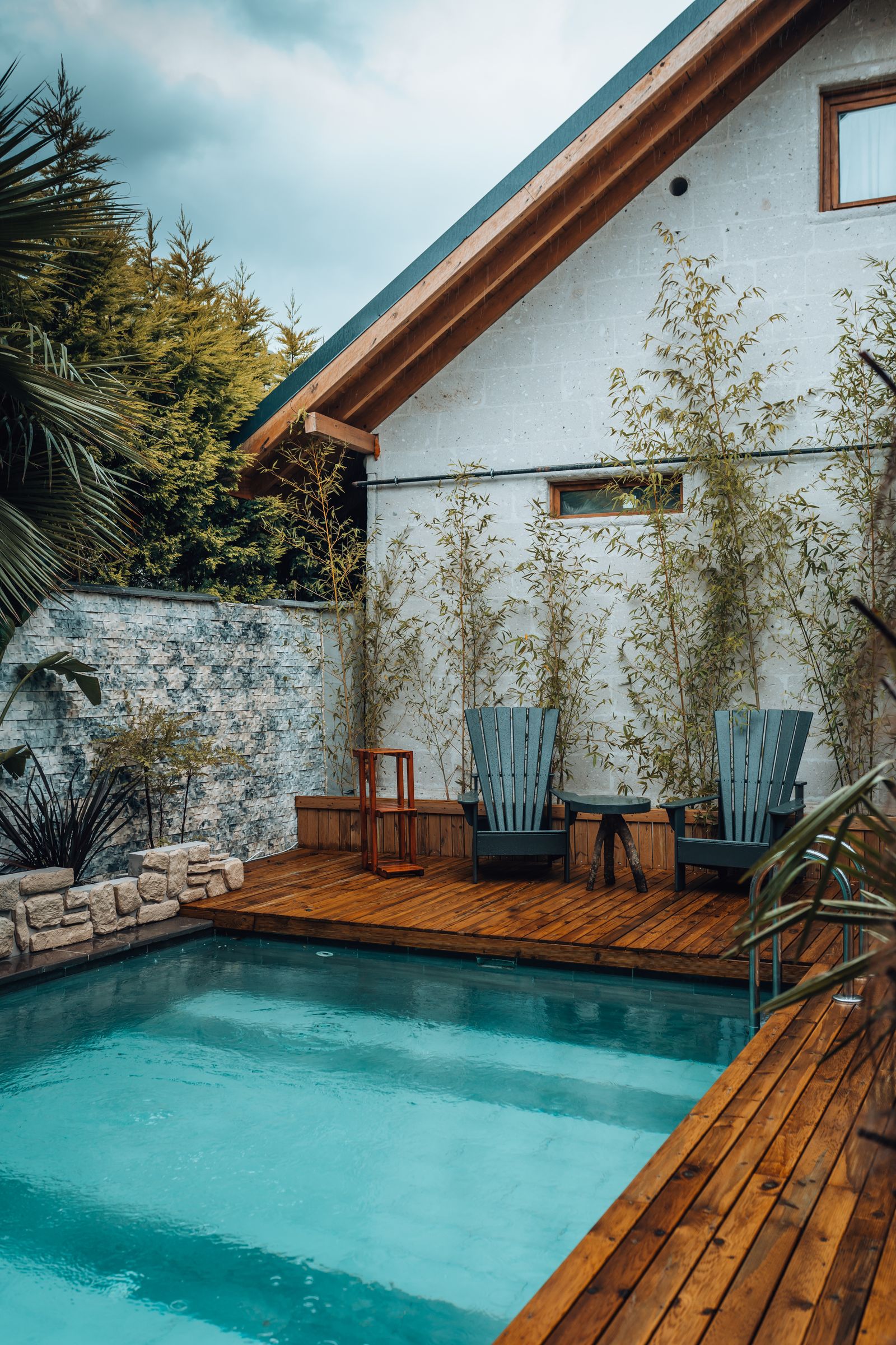Modern house exterior with a rectangular swimming pool and deck