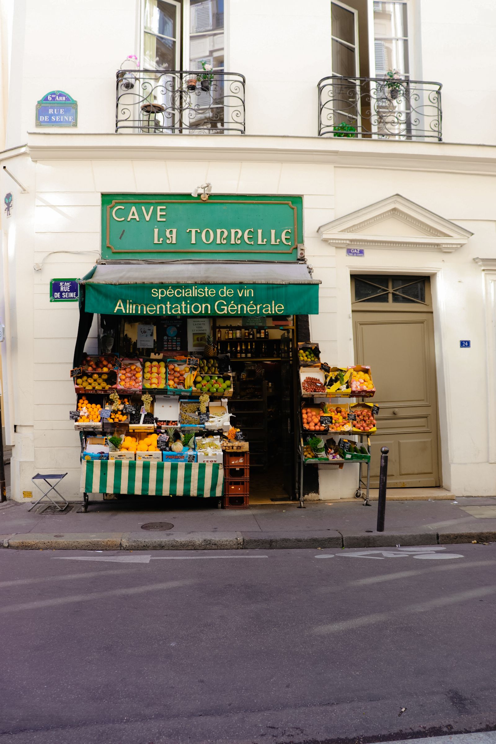 Street-level storefront with signage and glass display windows